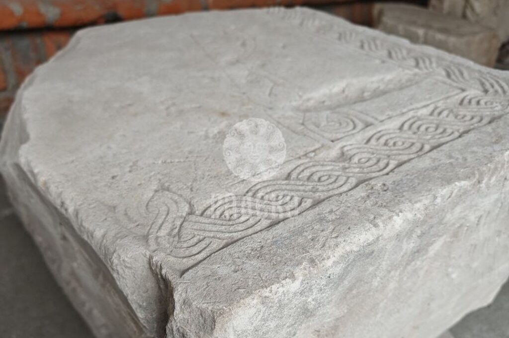 Woven carved ornament on a limestone slab at Krutitskoye Podvorye