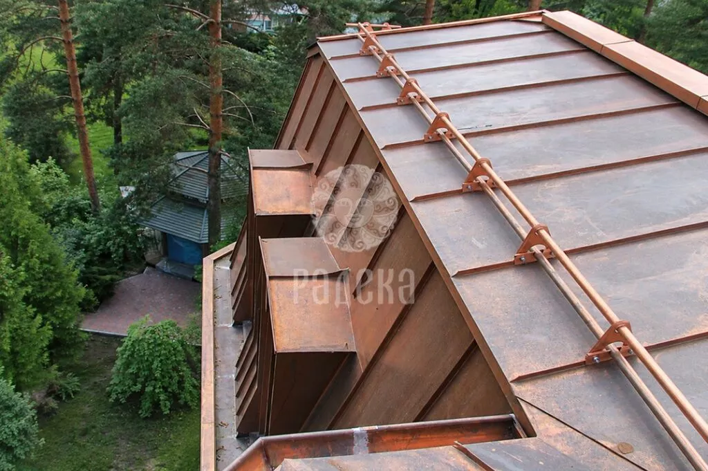 View from above of the copper roof with snow guards and dormer windows