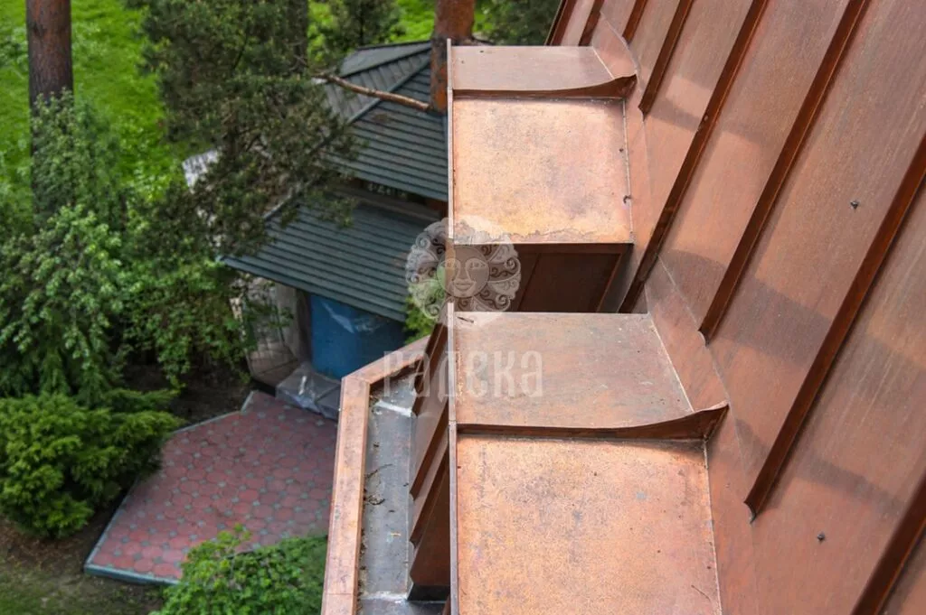 Copper coverings of two dormer windows viewed from above