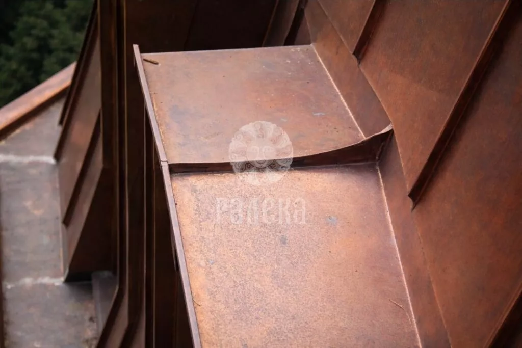 Copper covering of the upper part of the dormer window close-up